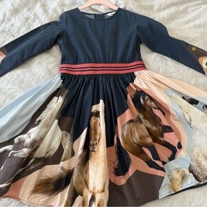 Molo dress. Cotton poplin. Skirt has print of horses. Back zip.